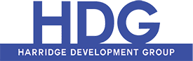 A blue and green logo for the national development corporation.